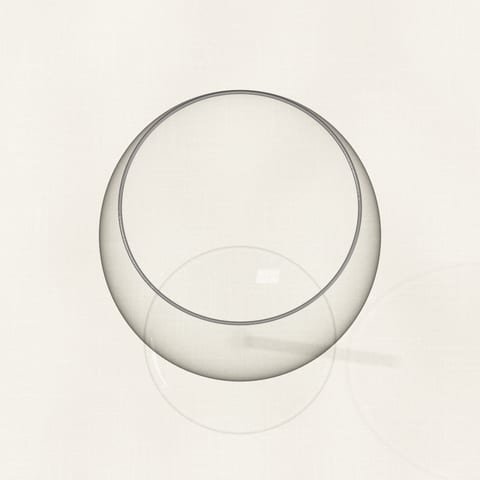 An empty, clean wine glass seen from above on a linen cloth